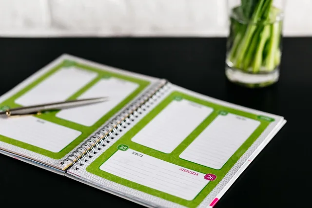 green, vase, interior, display, business, office, work, desk, table, notebook, pen. Bookkeeping Firm Scheduling: Deadlines and Capacity